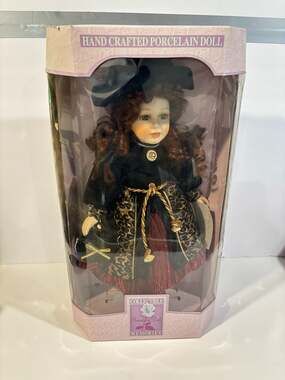 Collectible Memories Handcrafted Porcelain Doll with Red Hair and Leopard Print